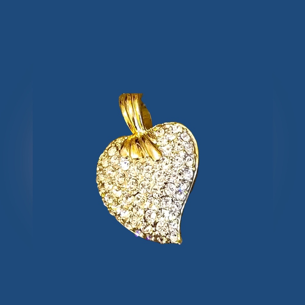 Pretty gold tone  and pave set crystals heart pendant.